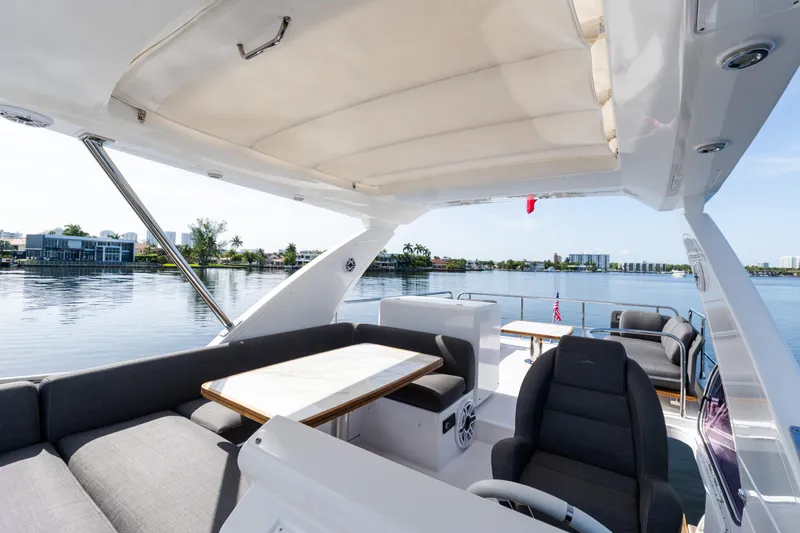 Slide: The Image of Luxurious 2023 Azimut Fly 50 yacht interior with elegant seating and scenic waterfront view. - 54