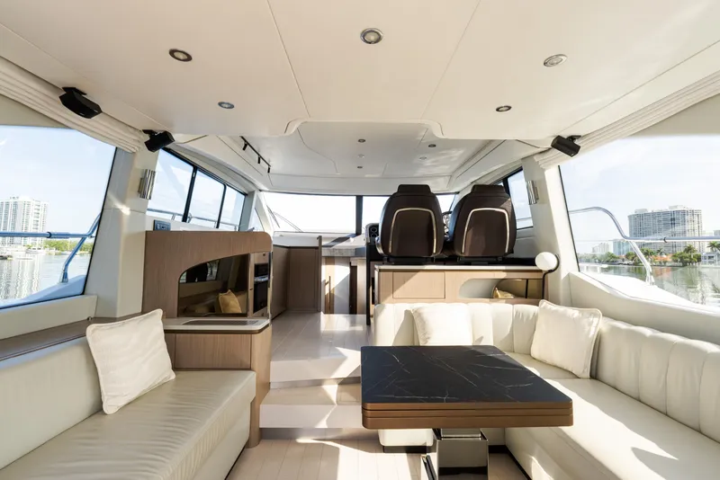 Slide: The Image of Luxurious interior of 2023 Azimut Fly 50 yacht with modern seating and panoramic windows. - 58