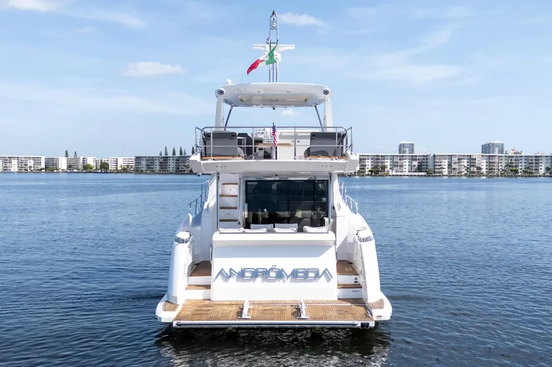 Slide: The Image of 2023 Azimut Fly 50 yacht on calm water, cityscape in background. - 8