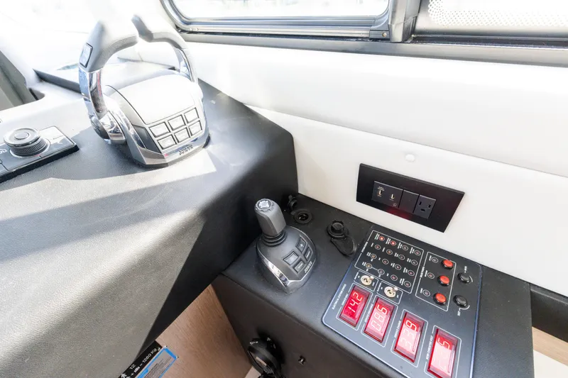 Slide: The Image of Control panel of 2023 Azimut Fly 50 yacht, featuring modern navigation and control systems. - 80