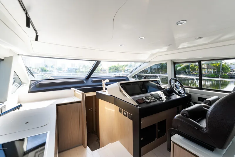 Slide: The Image of Luxurious 2023 Azimut Fly 50 yacht interior with modern helm and panoramic windows. - 81