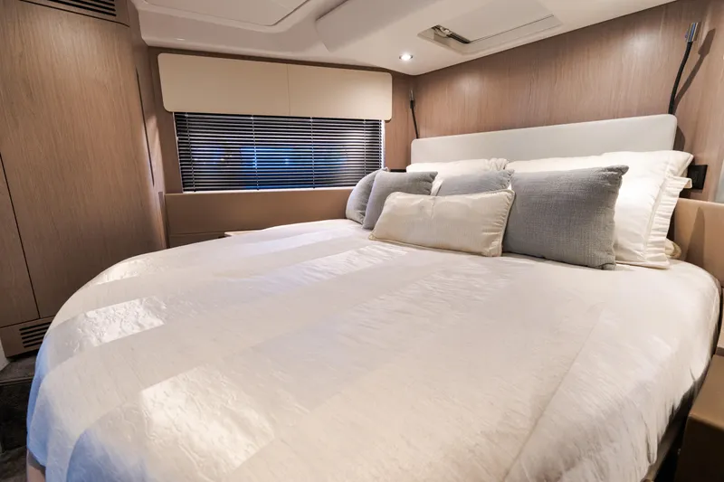Slide: The Image of Luxurious bedroom interior of 2023 Azimut Fly 50 yacht with elegant bedding and modern design. - 98