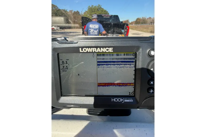 Slide: The Image of 2024 Mako Pro Skiff 15 CC boat on trailer, featuring a 60 HP Mercury engine. - 8