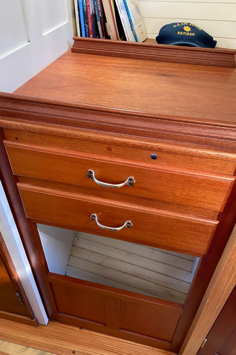 Slide: The Image of Wooden cabinet with drawers inside a 1929 Classic Lobster Cruiser boat. - 22