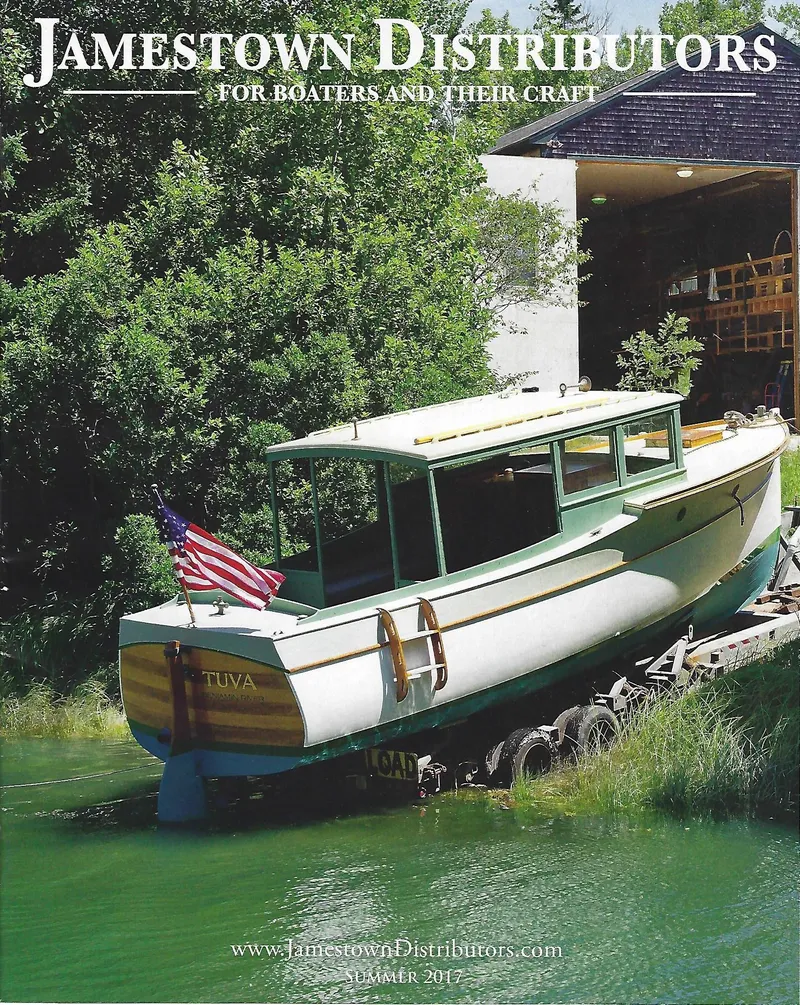 Slide: The Image of Classic 1929 Lobster Cruiser on green water, Jamestown Distributors cover, summer edition. - 7