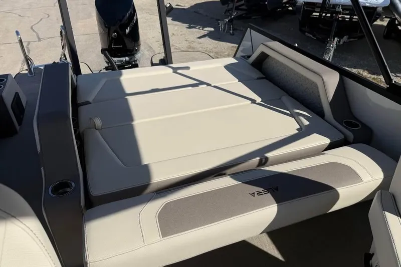 Slide: The Image of Alera M 25Q 2026 boat interior with beige seating and modern design. - 10