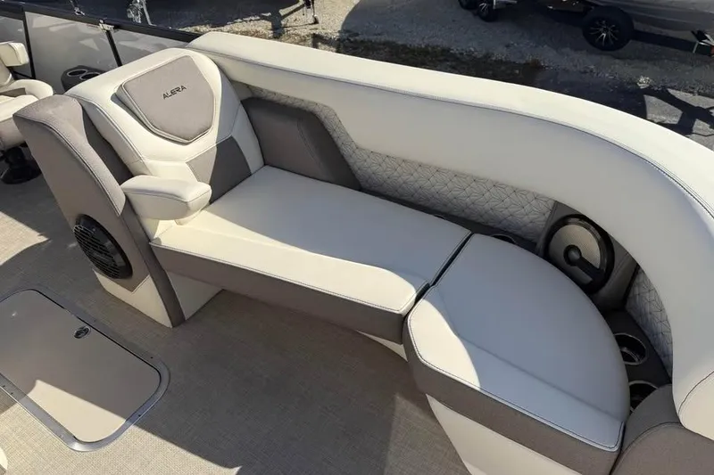 Slide: The Image of Luxurious seating on 2026 Alera M 25Q boat with elegant upholstery and integrated speakers. - 17