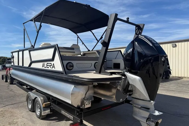 Slide: The Image of 2026 Alera M 25Q pontoon boat with Mercury outboard motor on trailer. - 5