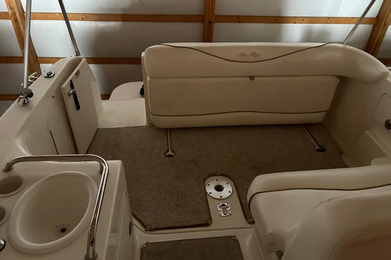 Slide: The Image of Interior of 2002 Sea Ray 260 Sundancer boat with seating and sink. - 13