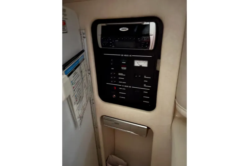 Slide: The Image of Control panel inside 2002 Sea Ray 260 Sundancer boat cabin. - 14