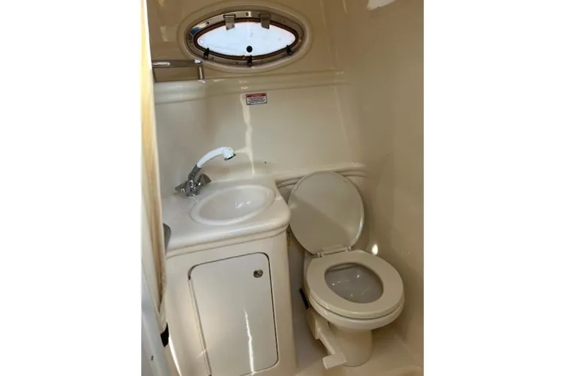 Slide: The Image of 2002 Sea Ray 260 Sundancer bathroom with sink and toilet. - 18