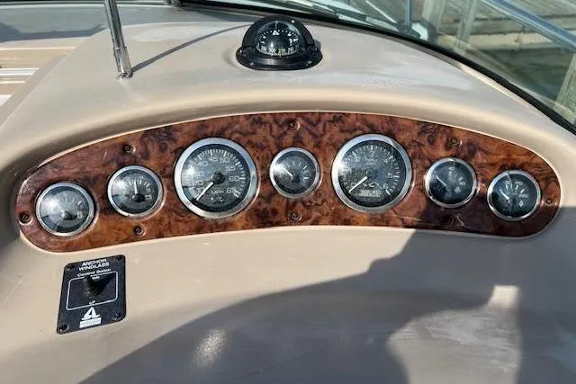 Slide: The Image of Dashboard of 2002 Sea Ray 260 Sundancer boat with gauges and compass. - 2