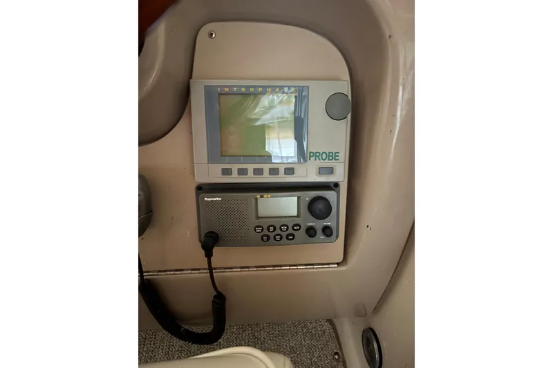 Slide: The Image of Control panel of a 2002 Sea Ray 260 Sundancer boat with navigation equipment. - 5
