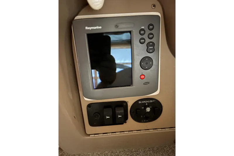 Slide: The Image of Raymarine control panel on 2002 Sea Ray 260 Sundancer boat dashboard. - 6