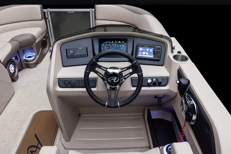 Slide: The Image of Manufacturer Provided Image: 2024 Avalon LSZ Quad Lounger boat dashboard with steering wheel and control panel. - 2