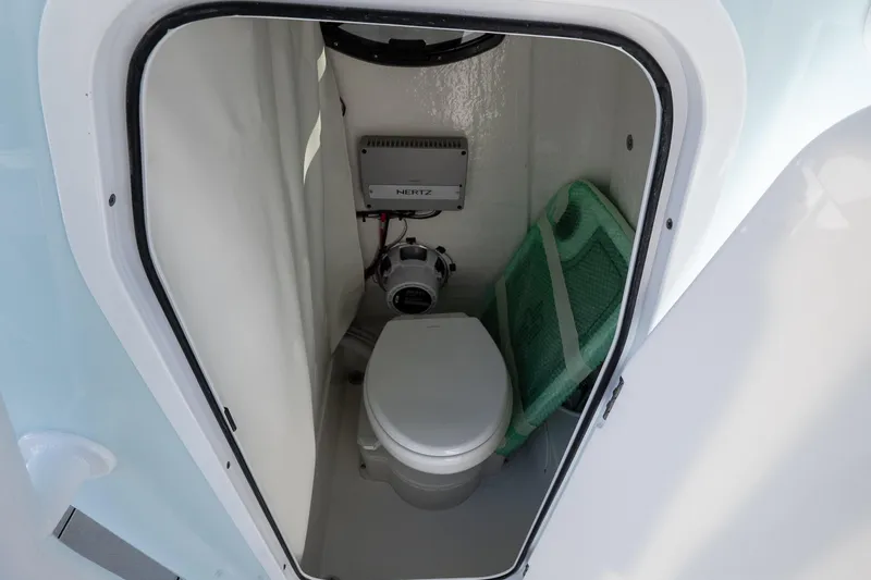 Slide: The Image of Compact marine toilet inside 2026 Sea Pro 225FLX Sandbar boat cabin. - 20
