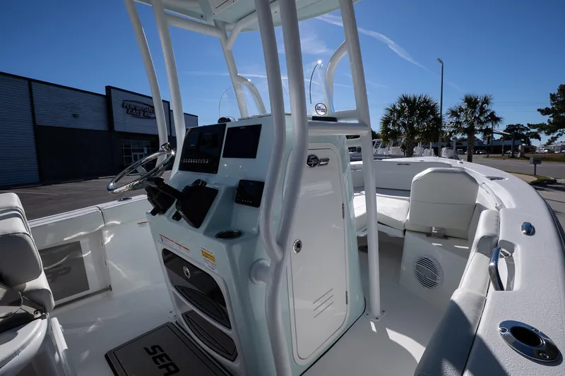 Slide: The Image of 2026 Sea Pro 225FLX Sandbar boat interior with modern helm and seating. - 14