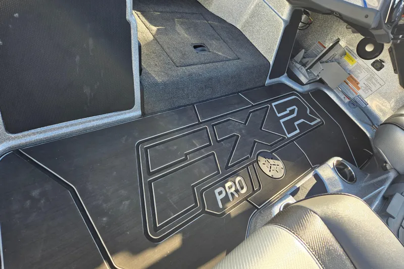 Slide: The Image of 2025 Skeeter FXR20 PRO boat interior with custom flooring and seating. - 10