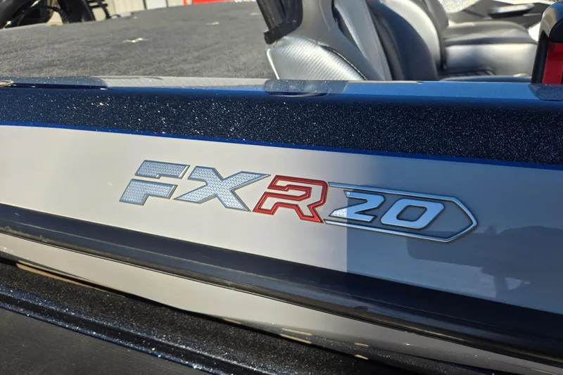 Slide: The Image of 2025 Skeeter FXR20 PRO boat logo on sleek, metallic surface. - 2