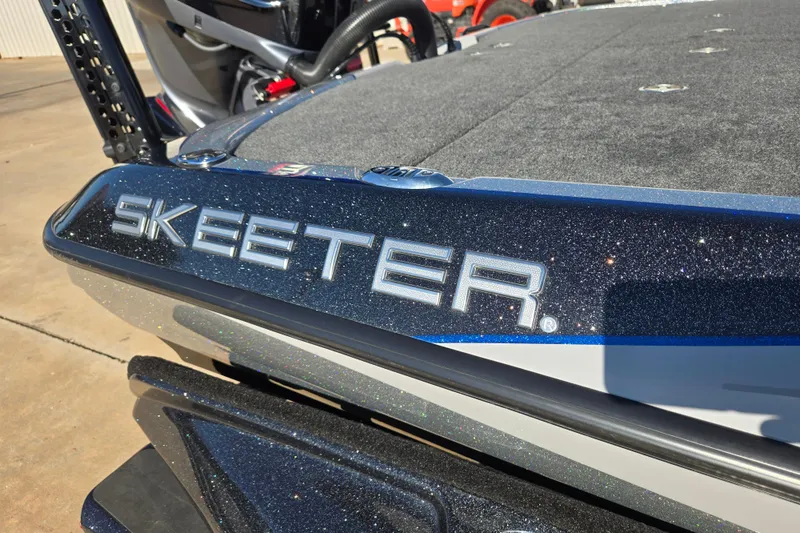 Slide: The Image of 2025 Skeeter FXR20 PRO boat with metallic finish and logo detail. - 5