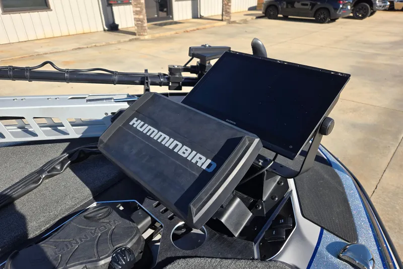 Slide: The Image of 2025 Skeeter FXR20 PRO boat with Humminbird and Garmin electronics on deck. - 8