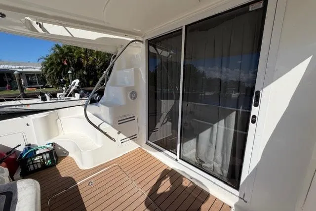 Slide: The Image of 2004 Sea Ray 420 Sedan Bridge yacht with teak deck and sliding glass doors. - 8