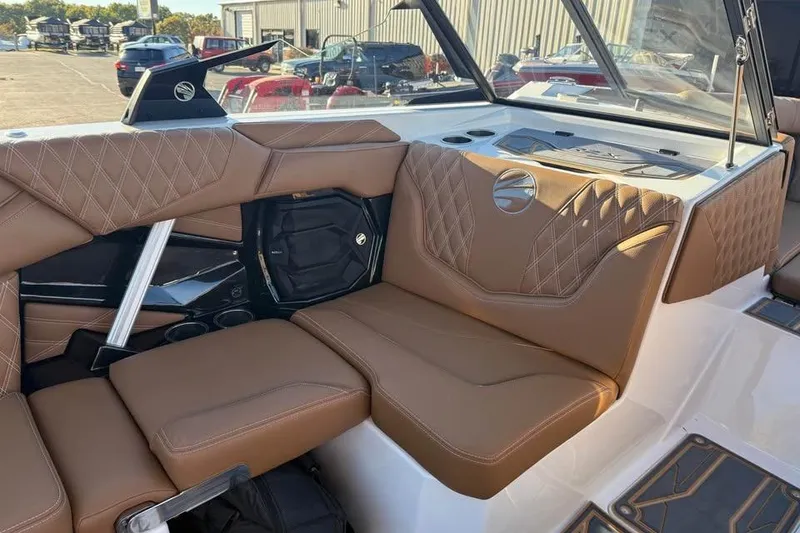 Slide: The Image of 2026 Tigé 22RZX boat interior with brown leather seating and diamond stitching. - 13