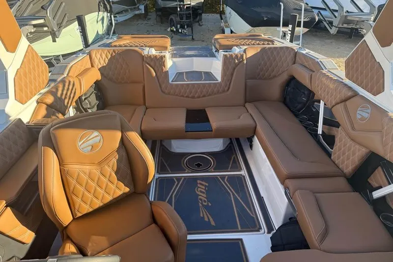 Slide: The Image of Luxurious interior of 2026 Tigé 22RZX boat with tan leather seating. - 16
