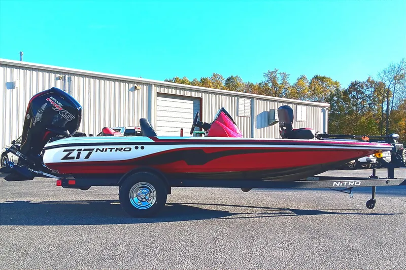 Slide: The Image of 2026 Nitro Z17 boat with Mercury engine, parked outdoors on a sunny day. - 3