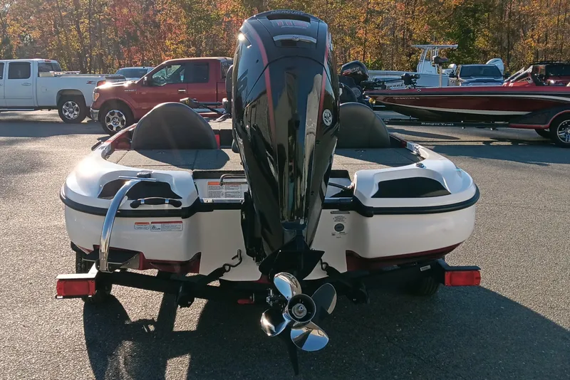 Slide: The Image of 2026 Nitro Z17 boat with powerful outboard motor, parked outdoors on a sunny day. - 7