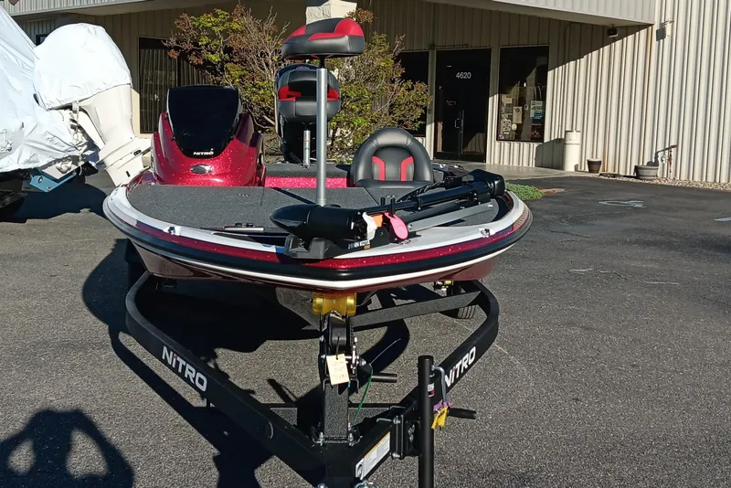 Slide: The Image of 2026 Nitro Z17 boat on trailer, parked outside a building. - 8