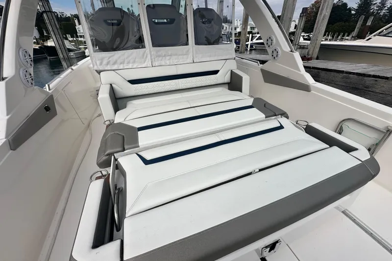 Slide: The Image of 2023 Tiara Yachts 34 LS boat interior with luxurious seating and modern design. - 12