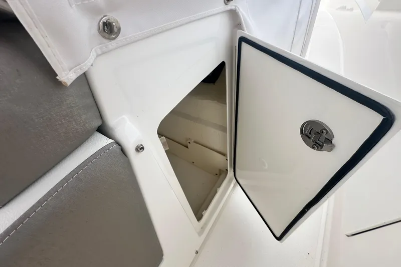 Slide: The Image of Open storage compartment on a 2023 Tiara Yachts 34 LS boat. - 14