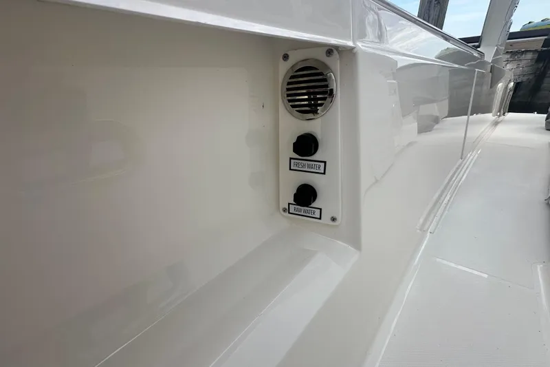 Slide: The Image of 2023 Tiara Yachts 34 LS water access panel with fresh and raw water options. - 18