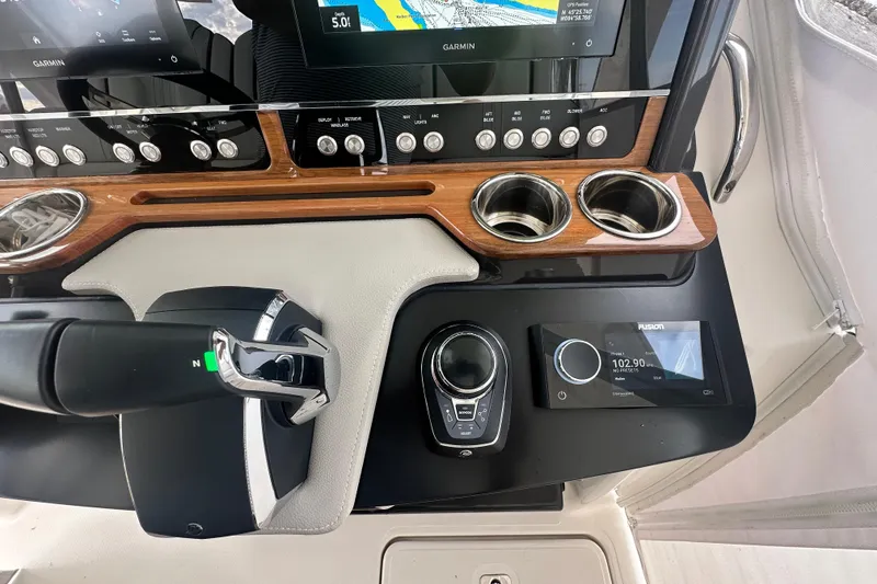 Slide: The Image of Dashboard of 2023 Tiara Yachts 34 LS with navigation and control systems. - 21