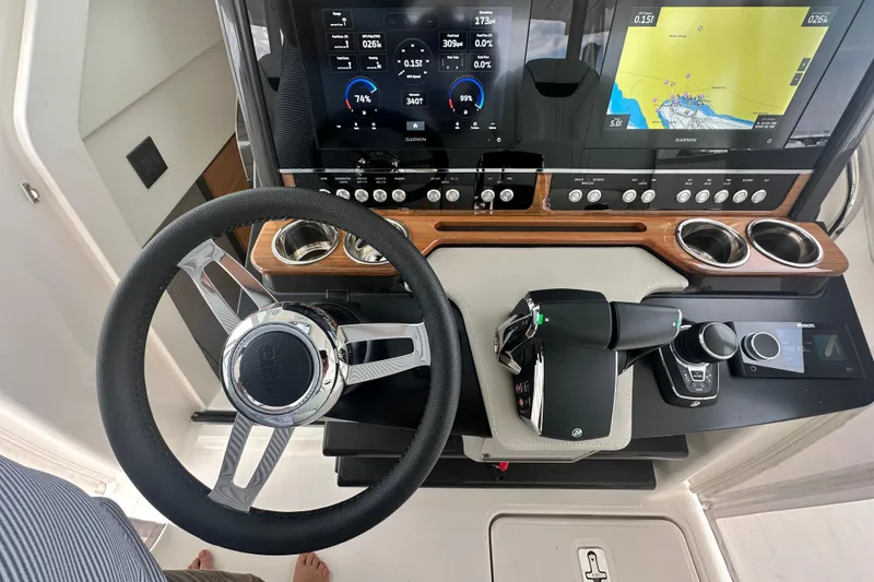 Slide: The Image of 2023 Tiara Yachts 34 LS helm with advanced navigation and control systems. - 22