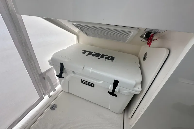 Slide: The Image of 2023 Tiara Yachts 34 LS with YETI cooler in storage compartment. - 25