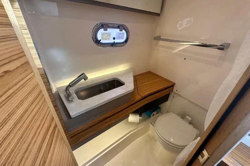 Slide: The Image of Luxurious 2023 Tiara Yachts 34 LS bathroom with modern sink and toilet. - 26