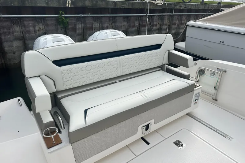 Slide: The Image of 2023 Tiara Yachts 34 LS boat seating with cup holders and modern design. - 7