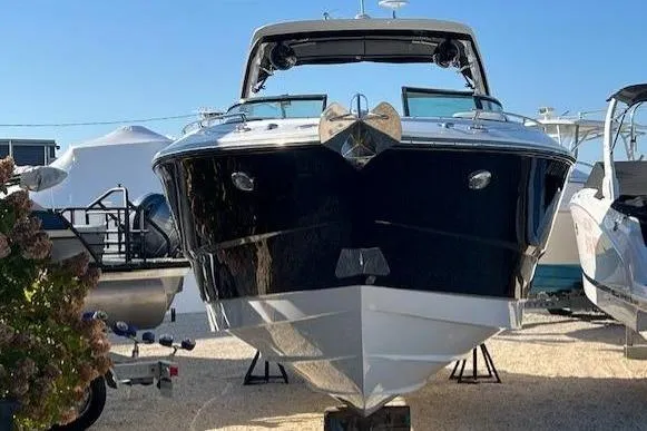 Slide: The Image of 2017 Monterey 328SS Super Sport boat displayed outdoors, front view. - 1