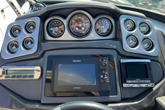 Slide: The Image of Dashboard of a 2017 Monterey 328SS Super Sport boat with gauges and navigation system. - 10