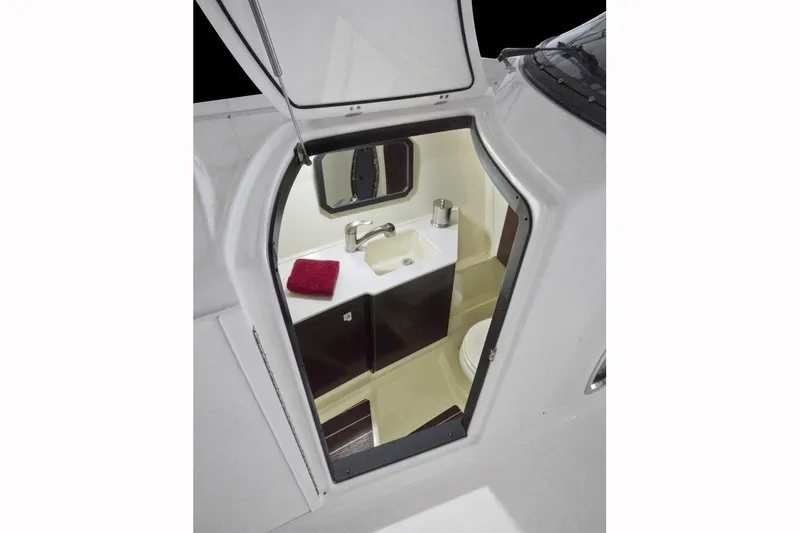 Slide: The Image of Manufacturer Provided Image: 2017 Monterey 328SS Super Sport boat interior bathroom with sink and mirror. - 17