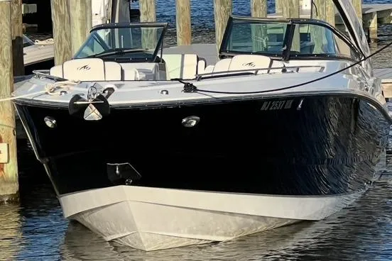 Slide: The Image of 2017 Monterey 328SS Super Sport boat docked at marina, front view. - 2