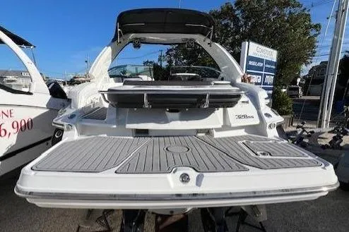 Slide: The Image of 2017 Monterey 328SS Super Sport boat, rear view, in a marina setting. - 6