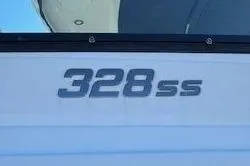 Slide: The Image of 2017 Monterey 328SS Super Sport boat logo on white surface. - 7