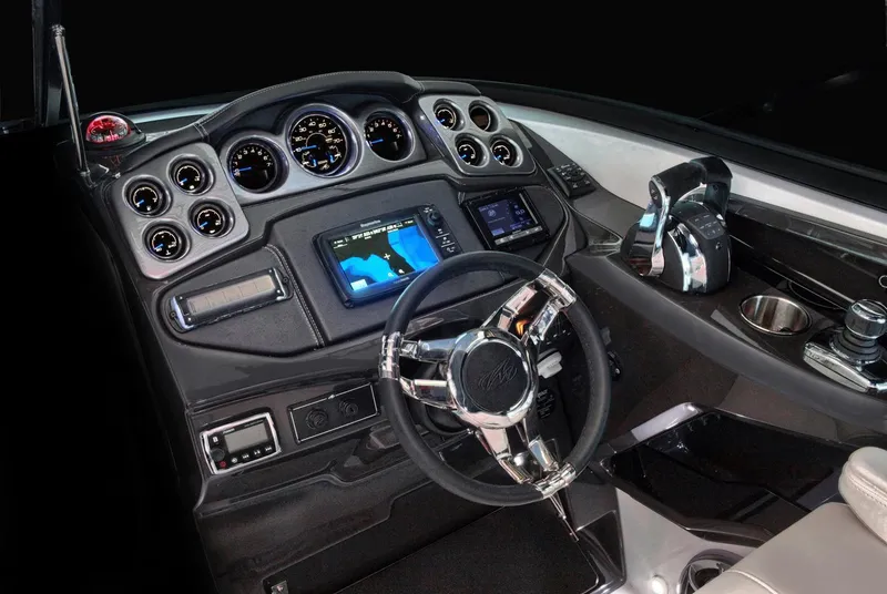 Slide: The Image of Manufacturer Provided Image: 2017 Monterey 328SS Super Sport dashboard with gauges, steering wheel, and navigation display. - 8