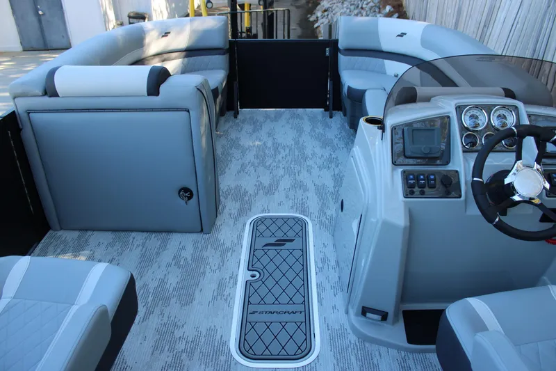 Slide: The Image of Interior of 2026 Starcraft EXS 3 boat with modern seating and control panel. - 10