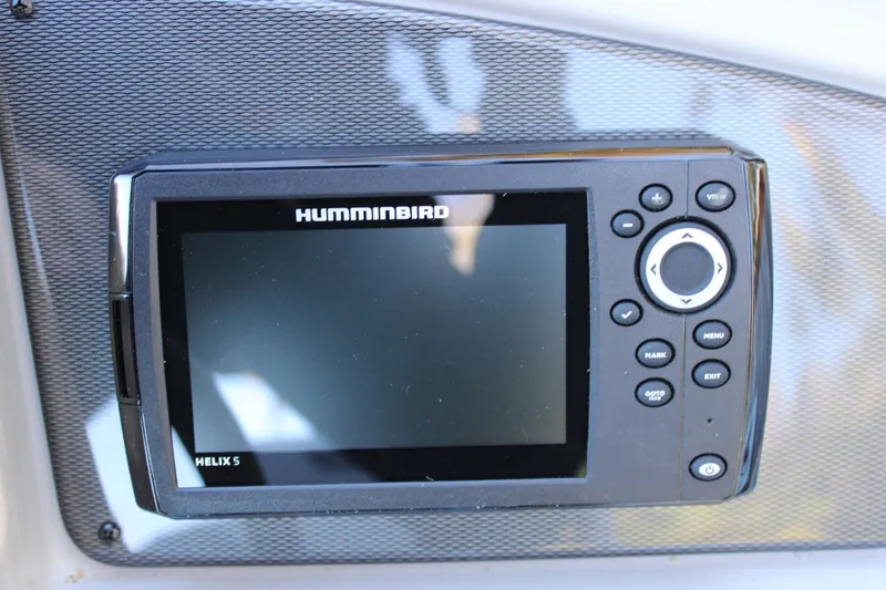Slide: The Image of Humminbird Helix 5 fish finder on 2026 Starcraft EXS 3 boat dashboard. - 13