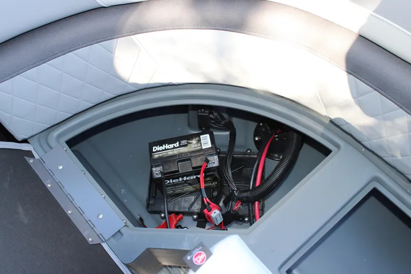 Slide: The Image of Battery compartment of 2026 Starcraft EXS 3 boat with DieHard battery installed. - 17