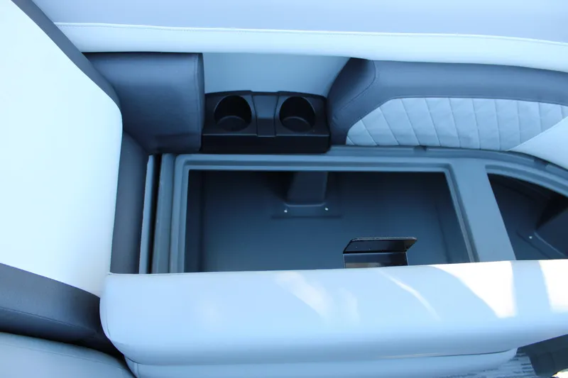Slide: The Image of Interior of 2026 Starcraft EXS 3 boat with storage compartment and cup holders. - 18